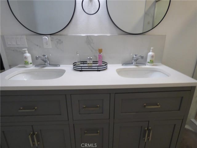 bathroom featuring tasteful backsplash and vanity