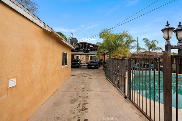 exterior space featuring a fenced in pool