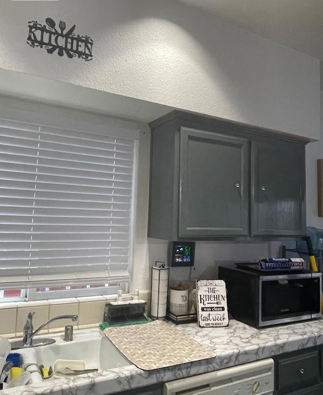 kitchen with dishwashing machine and sink