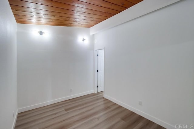 spare room with wooden ceiling and light hardwood / wood-style flooring