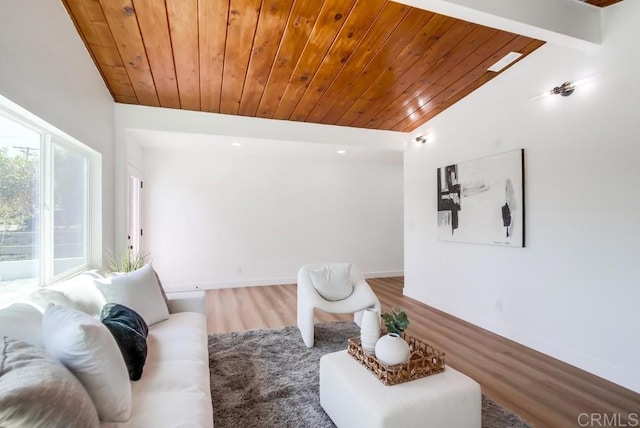 living room with lofted ceiling with beams, hardwood / wood-style floors, and wooden ceiling