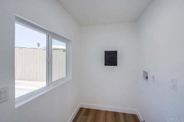 laundry room with hookup for a washing machine and hardwood / wood-style flooring