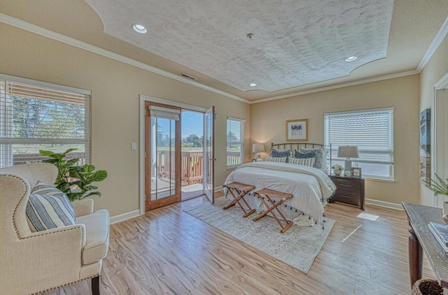 bedroom with crown molding, a textured ceiling, light hardwood / wood-style flooring, and access to outside