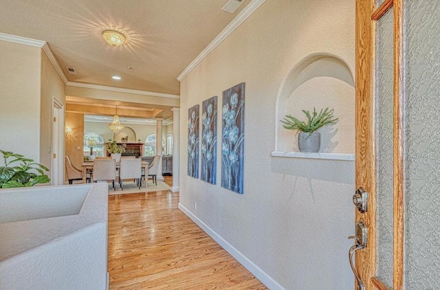 hall featuring ornamental molding and wood-type flooring