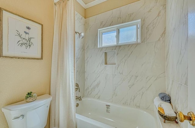 bathroom featuring ornamental molding, toilet, and shower / bath combo