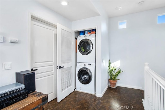 laundry room featuring stacked washer and clothes dryer