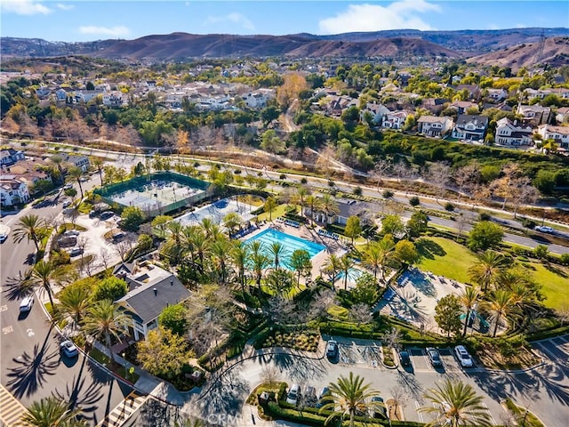 birds eye view of property featuring a mountain view