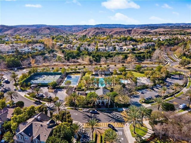 birds eye view of property with a mountain view