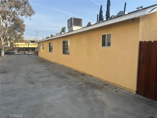 view of side of property with cooling unit