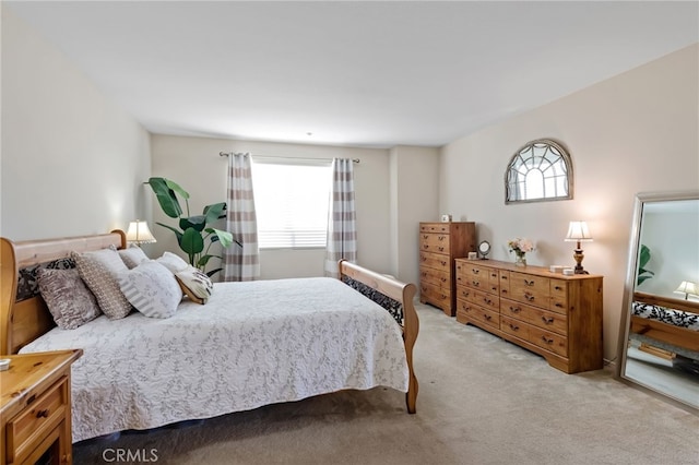 bedroom with light carpet