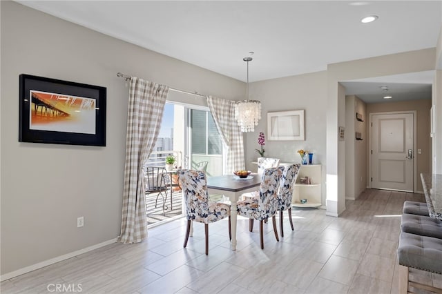 dining area featuring a chandelier