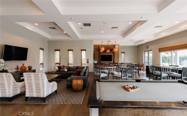 game room with hardwood / wood-style flooring, pool table, and a raised ceiling