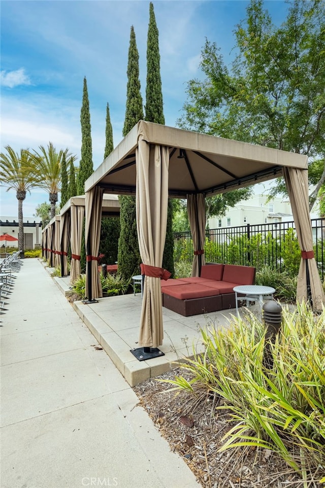 view of property's community featuring a gazebo and a patio