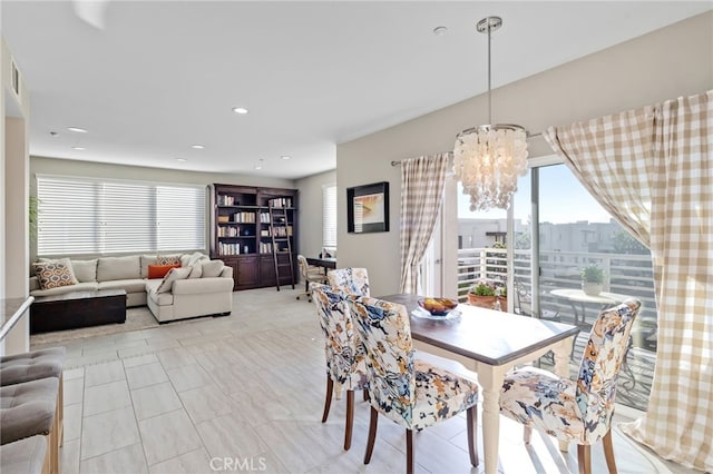 dining area featuring a chandelier