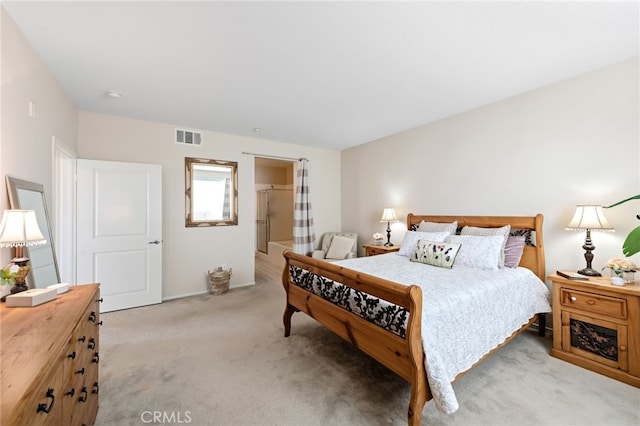 bedroom with light colored carpet