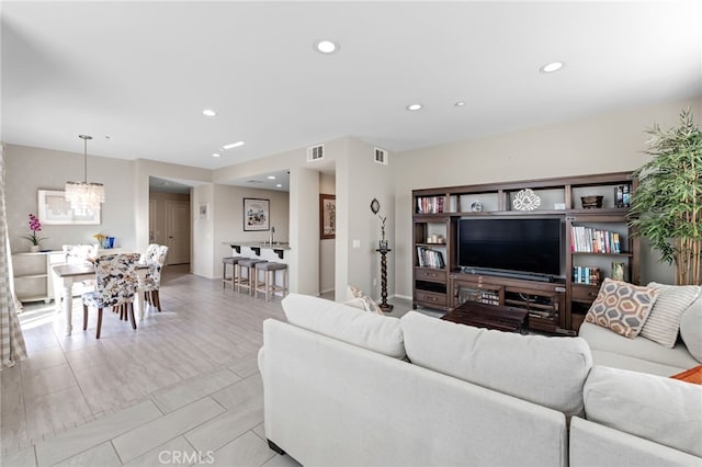 living room with a notable chandelier