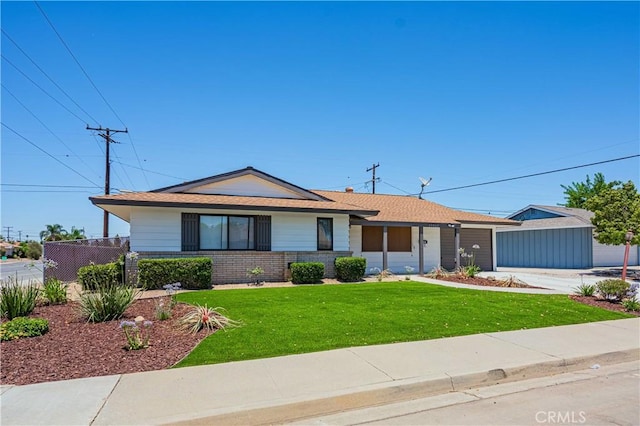 single story home featuring a garage and a front lawn