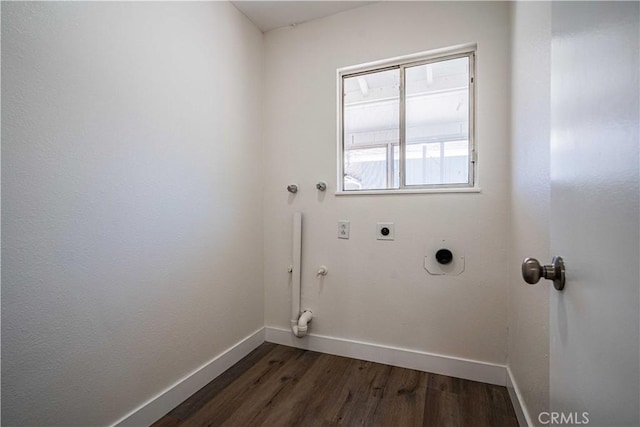 laundry room featuring gas dryer hookup, hookup for an electric dryer, and dark hardwood / wood-style flooring