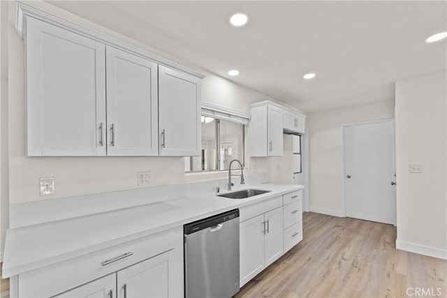 29460 Thornhill, Menifee, CA 92586 - kitchen with baseboards, a sink, light countertops, light wood-type flooring, and stainless steel dishwasher