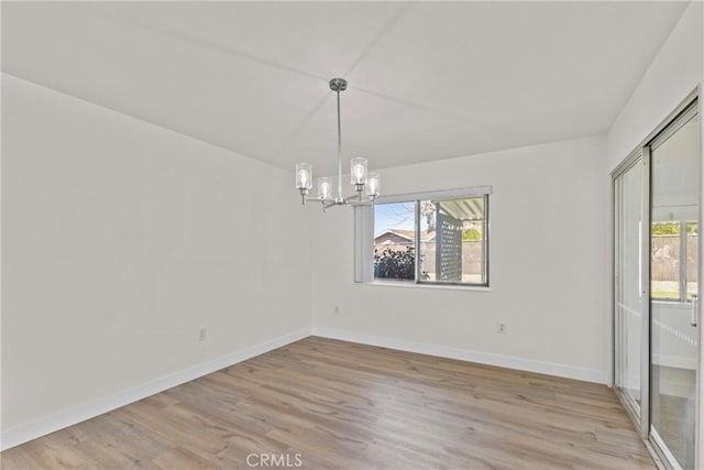 29460 Thornhill, Menifee, CA 92586 - unfurnished dining area with baseboards, a notable chandelier, and light wood-style floors