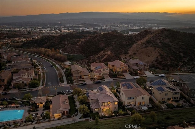 aerial view at dusk with a mountain view