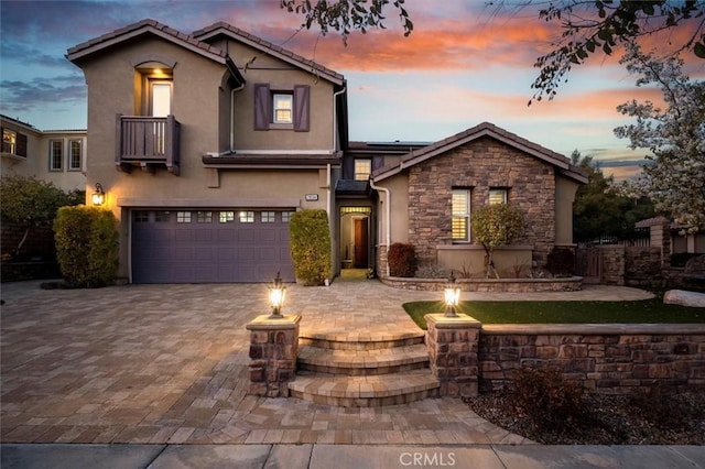 view of front facade with a garage and a fire pit