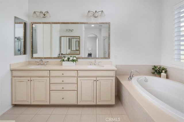 bathroom with vanity, independent shower and bath, and tile patterned flooring