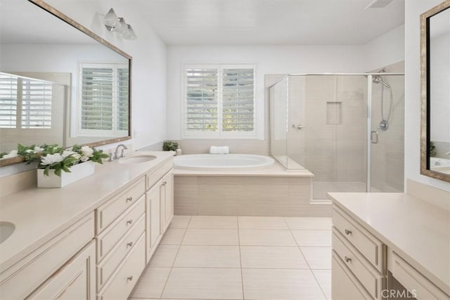 bathroom featuring vanity, tile patterned floors, and plus walk in shower