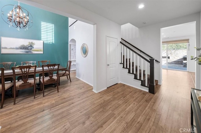 dining space featuring a chandelier and light hardwood / wood-style flooring