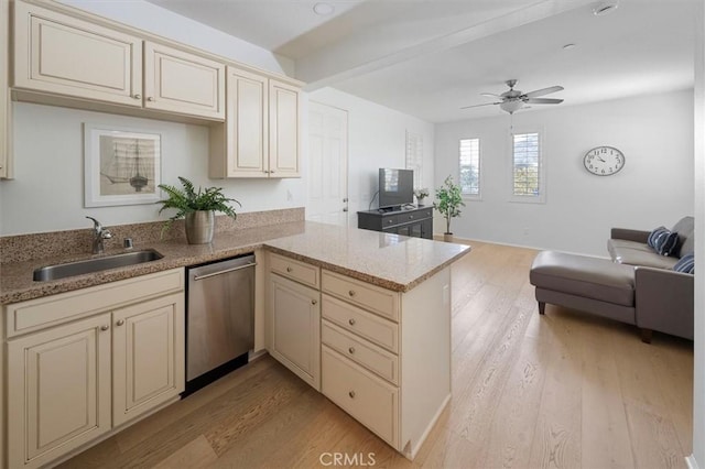 kitchen featuring dishwasher, cream cabinets, sink, and kitchen peninsula