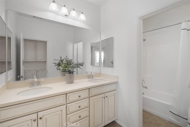 bathroom with vanity, shower / tub combo with curtain, and tile patterned floors