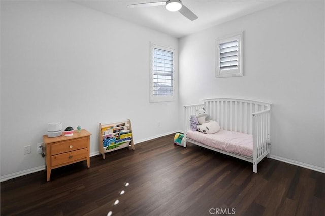 bedroom featuring dark wood-type flooring and ceiling fan