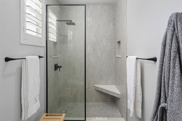 bathroom with tiled shower