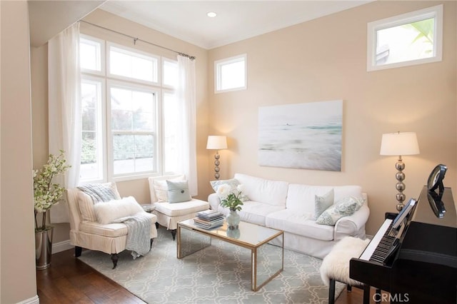 living area with dark wood-style floors, baseboards, crown molding, and recessed lighting