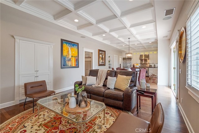 living room with beamed ceiling, crown molding, coffered ceiling, and hardwood / wood-style floors