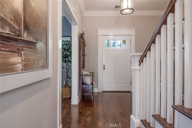 foyer featuring dark wood-type flooring and ornamental molding