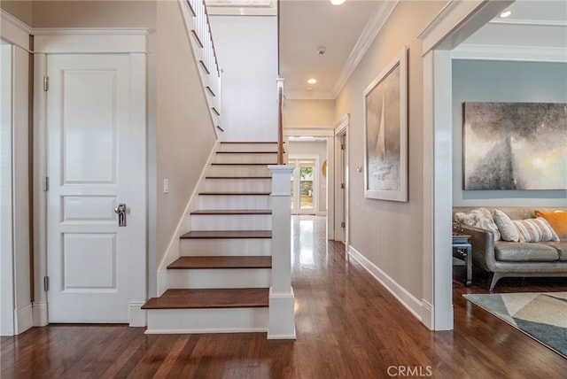 stairway featuring hardwood / wood-style flooring and crown molding