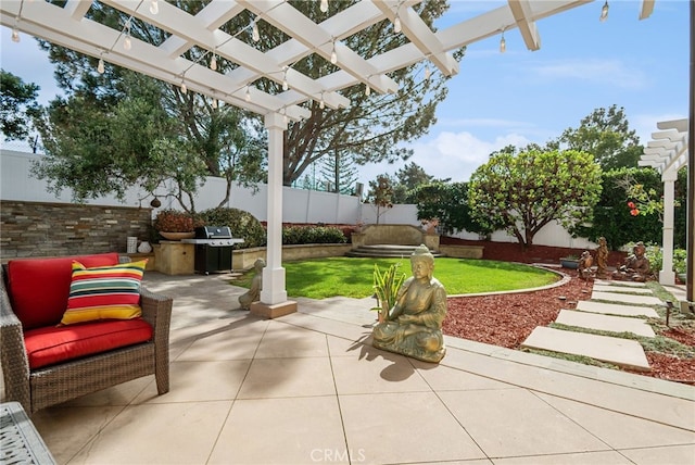 view of patio / terrace with area for grilling and a pergola