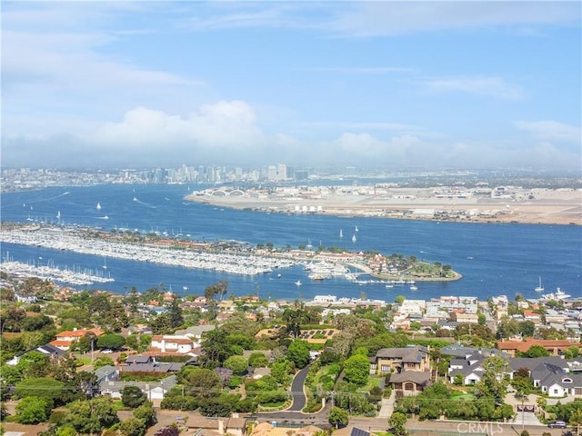 birds eye view of property with a water view