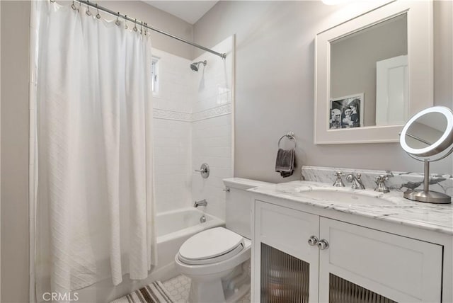 full bathroom featuring shower / tub combo with curtain, vanity, and toilet