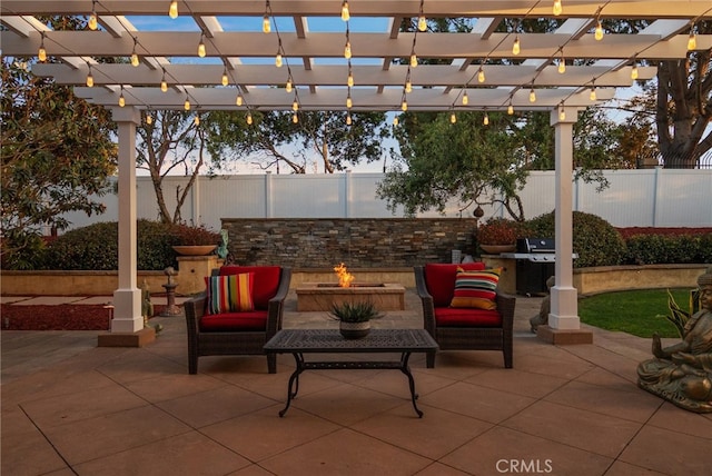 view of patio / terrace with area for grilling, a pergola, and an outdoor living space with a fire pit