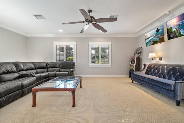 carpeted living room with crown molding and ceiling fan