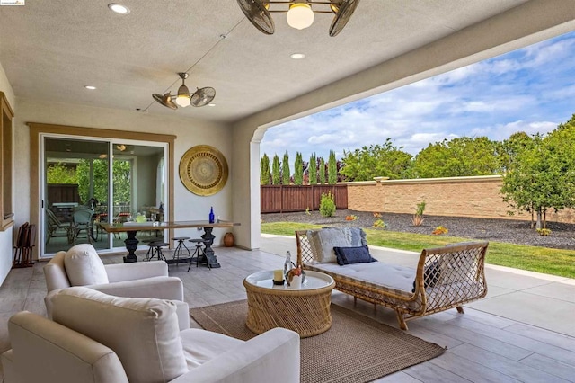 view of patio featuring outdoor lounge area and ceiling fan