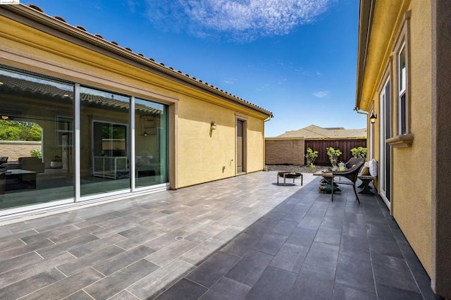 view of patio with a fire pit