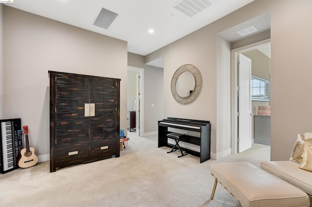 sitting room with light colored carpet