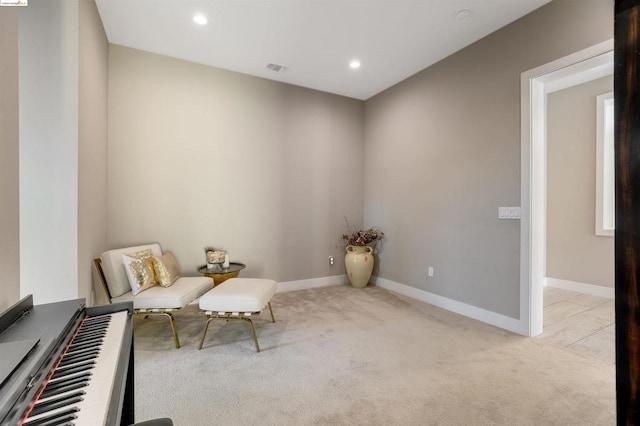 unfurnished room featuring light colored carpet