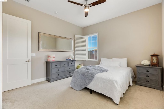 bedroom featuring ceiling fan and light colored carpet