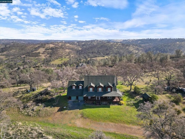 birds eye view of property featuring a mountain view