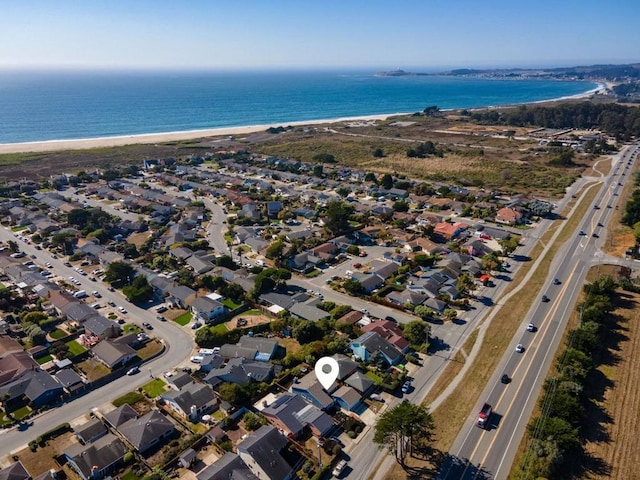 bird's eye view with a beach view and a water view