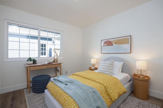 bedroom with wood-type flooring